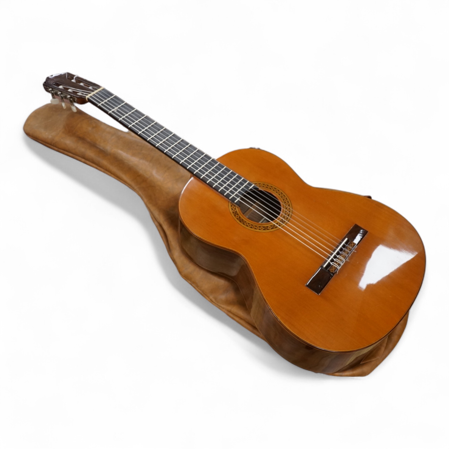 A Spanish Manuel Contreras classical guitar, with cedar front, Indian rosewood back sides and ebony fingerboard, with makers label inside body; M.G. Contreras, Madrid, back 49cm
